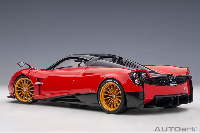 AUTOart 1/18 scale Pagani Huayra Roadster diecast in Rosso Monza Red, featuring detailed exterior and interior design.