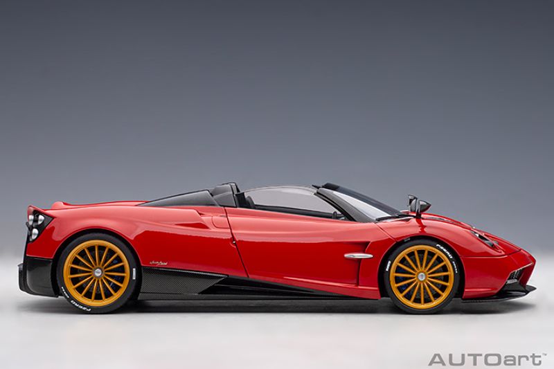 Meticulously detailed 1/18 diecast model of the Pagani Huayra Roadster in Rosso Monza Red, perfect for collectors.