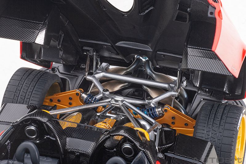 Detailed diecast model of Pagani Huayra Roadster in Rosso Monza Red, showcasing exquisite design and craftsmanship.