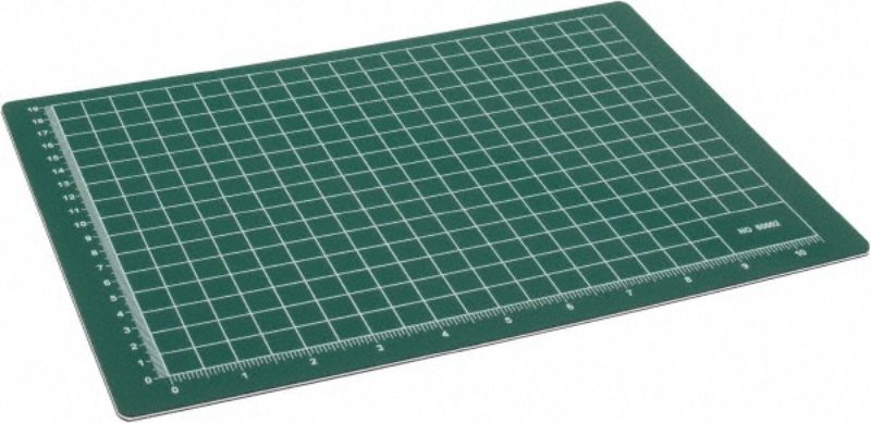 Self-healing green cutting mat 12" x 18" with a one-inch grid for precise cutting, ideal for crafters and hobbyists.