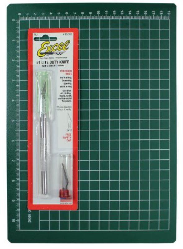 Excel Blades Precision Cutting Kit with K1 knife, 5 replacement blades, and 8.5” x 12” cutting mat featuring grid pattern.