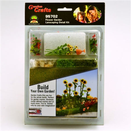 Enchanting miniature garden kit featuring fairy houses, colorful flowers, and playful figures for creative landscaping projects.