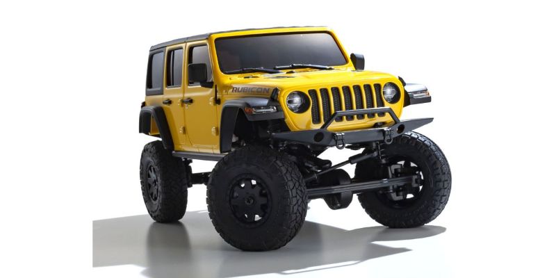 Kyosho MX-01 Wrangler Unlimited in yellow, a detailed, electric-powered mini RC crawler with 4x4 chassis for off-road performance.
