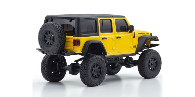 Kyosho MX-01 Wrangler Unlimited RC car in yellow, featuring detailed design and 4x4 chassis for superior off-road performance.