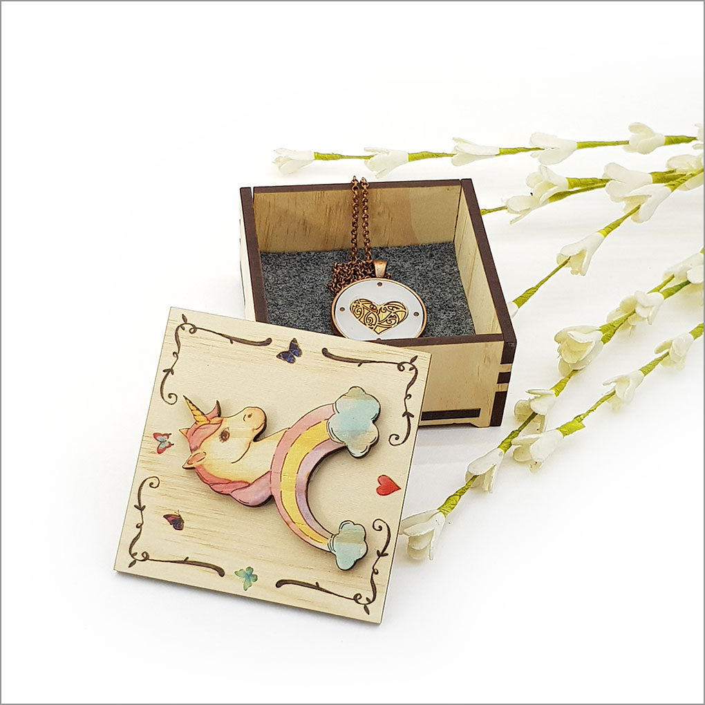 Small trinket box featuring a whimsical unicorn design, crafted from durable NZ Pine veneer, perfect for jewelry storage.