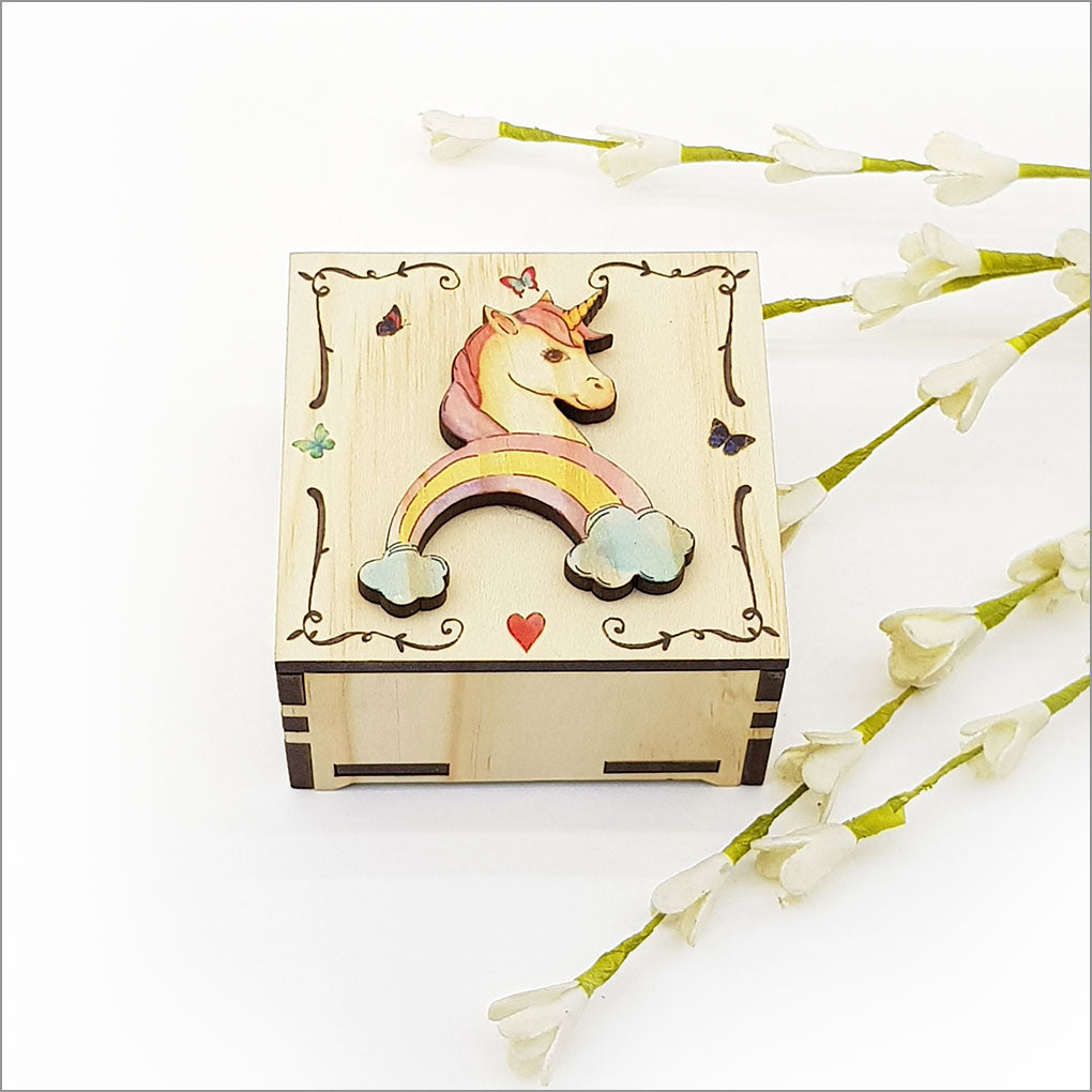 Small trinket box with a whimsical unicorn design, made from NZ Pine veneer, perfect for storing jewelry or treasures.