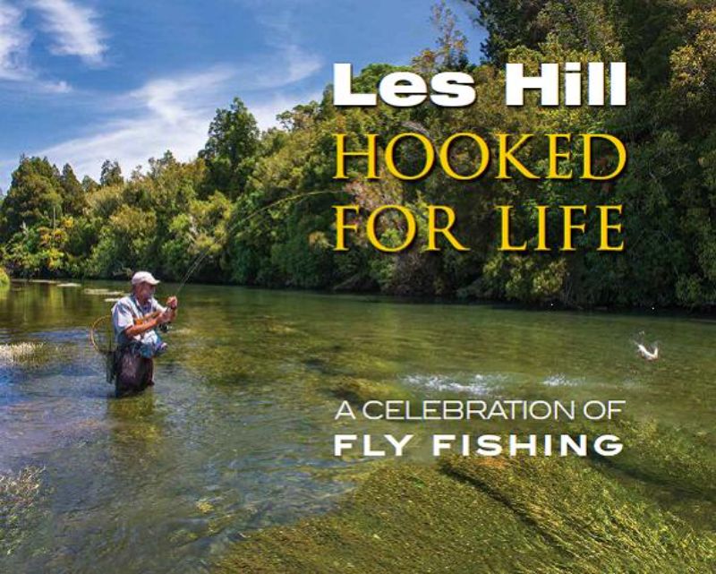Hardcover book "Hooked for Life" by Les Hill, featuring 208 pages of fly fishing stories, tips, and stunning photographs of New Zealand.