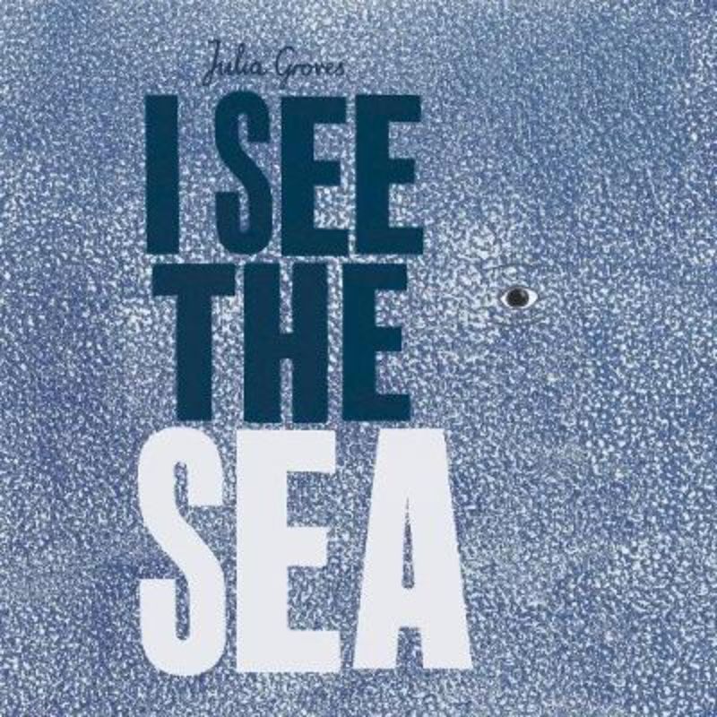 Colorful children's book "I See The Sea" featuring stunning ocean illustrations and engaging die-cut holes for interactive learning.