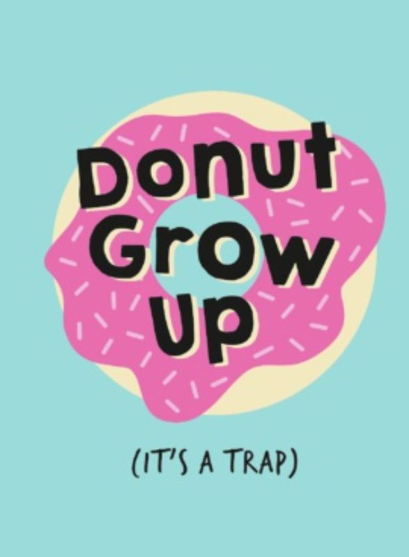 Hardback book titled "Don't Grow Up It's A Trap," featuring whimsical quotes celebrating youth and carefree living.