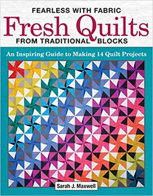 "Cover of 'Fearless With Fabric' project book by Sarah J. Maxwell, featuring vibrant quilts and creative quilting tips."