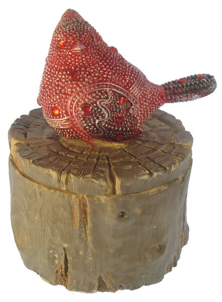 Charming wooden box with a bird on a textured tree trunk, perfect for organizing small items in any room.