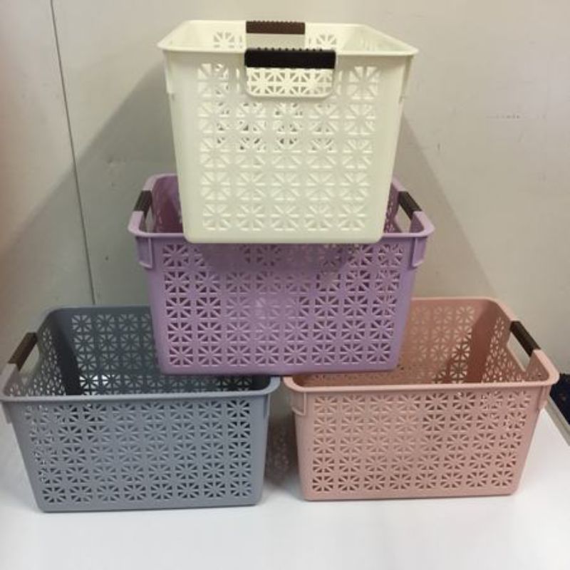 Set of 12 durable plastic baskets in assorted colors, measuring 31 x 22 x 17.5cm, perfect for versatile storage and organization.