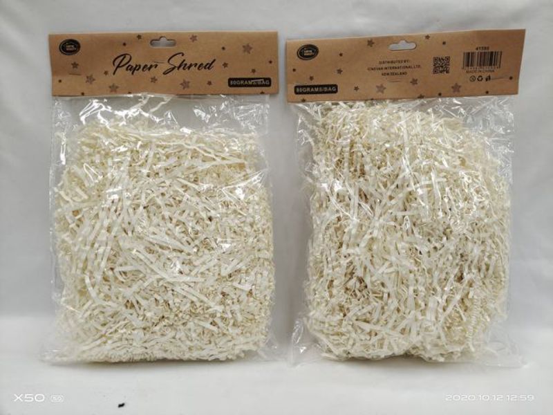 Cream paper shred, 80g per pack, ideal for gift baskets and crafts; adds elegance to decorations and is eco-friendly.
