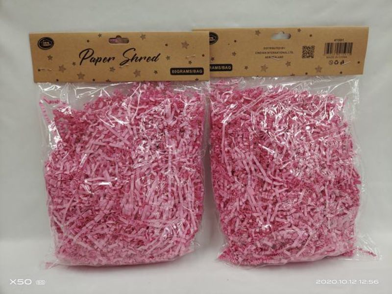 Vibrant pink shredded paper in 80g packs, perfect for gift wrapping, crafting, and eco-friendly decor. Set of 12.