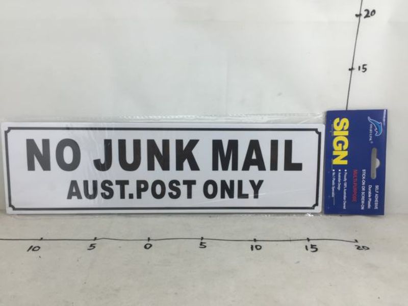 Set of 6 durable black and white plastic signs stating "NO JUNK MAIL" for easy outdoor installation and curb appeal.