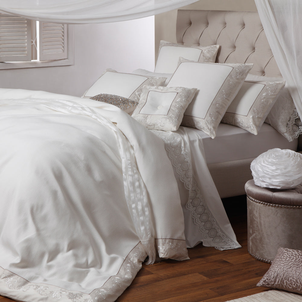 Queen duvet cover in ivory jacquard with dobby diamond pattern, latte embroidery, and luxe details, enhancing bedroom elegance.