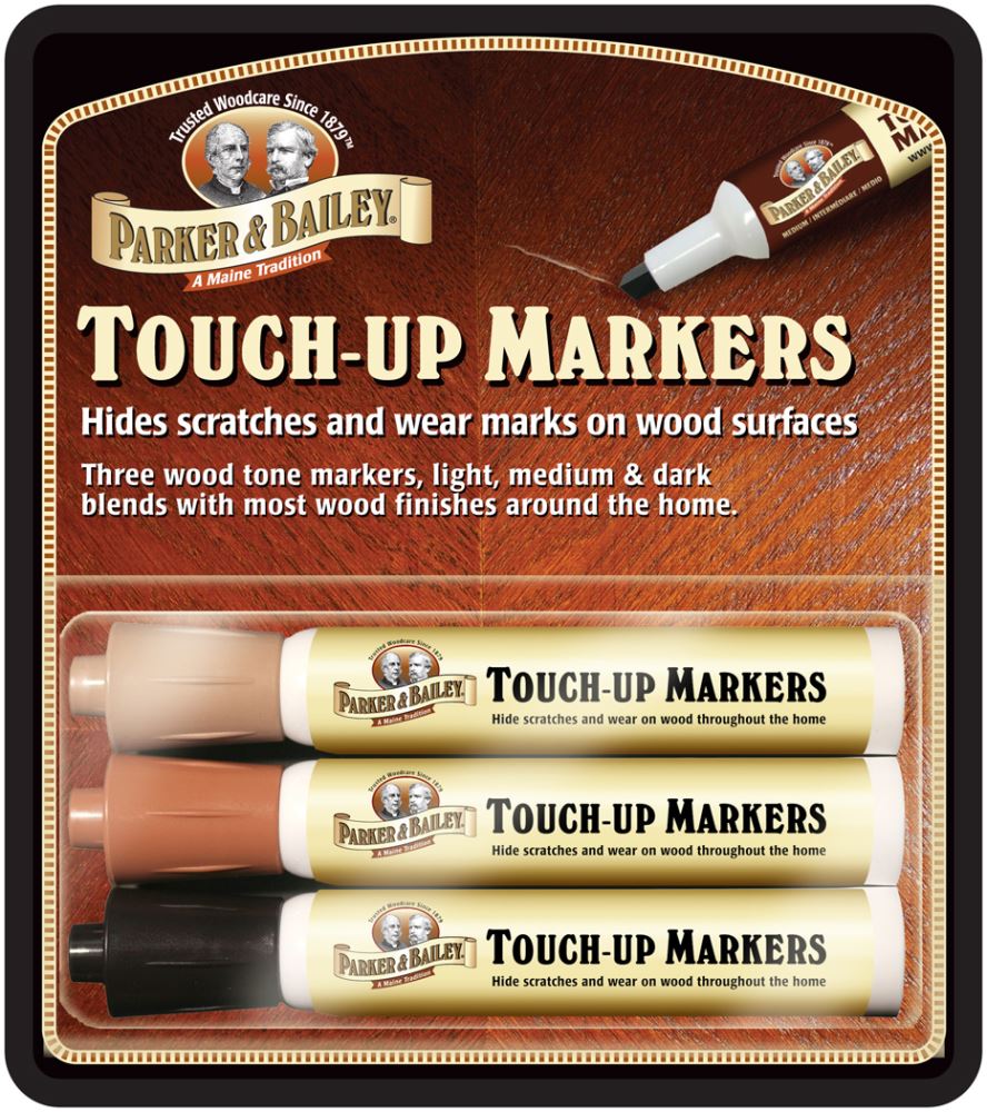 Parker Bailey wood touch-up markers in three tones, perfect for repairing scratches on furniture and hardwood floors.