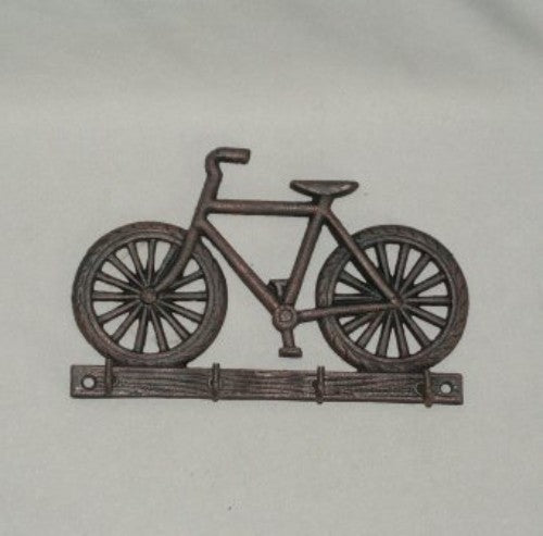 Stylish bike-inspired key rack made of solid cast iron, featuring multiple hooks for organized key storage.