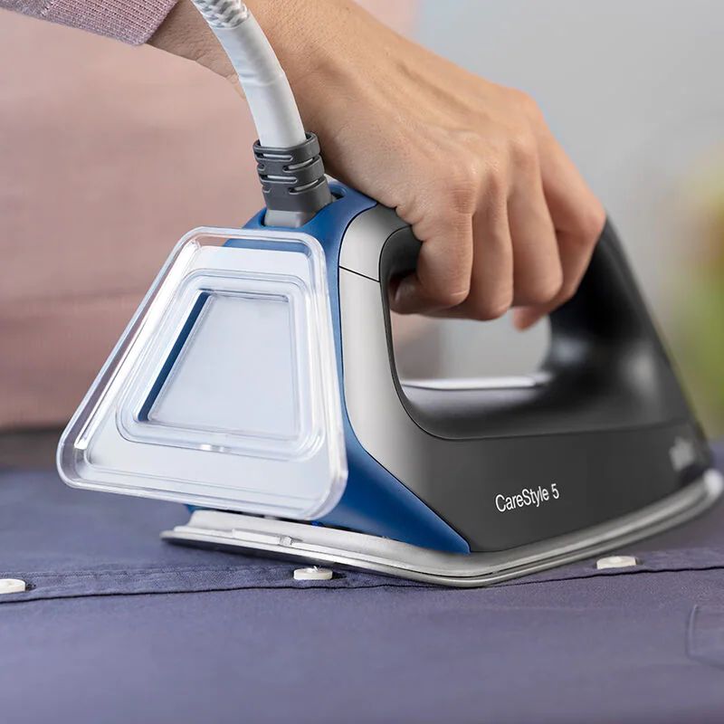 Braun CareStyle 5 Steam Generator Station in black, featuring 2400W power, double steam tech, and a 2L removable water tank.
