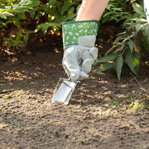 Compact stainless steel foldable hand shovel, perfect for indoor gardening and potting small plants.