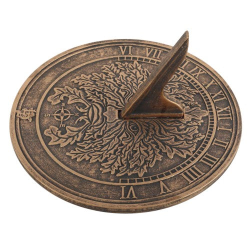 Green Man terracotta sundial by Lisa Parker, showcasing a bronze finish, perfect for telling time and enhancing garden decor.