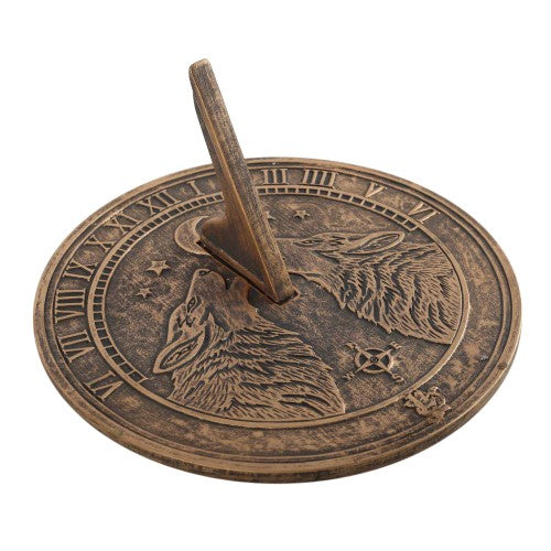 Howling Wolves terracotta sundial by Lisa Parker, featuring a rustic bronze finish and a wolf design, perfect for garden decor.