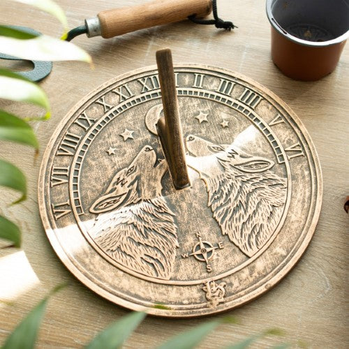 Howling Wolves terracotta sundial by Lisa Parker, featuring a rustic wolf design, perfect for garden decor and timekeeping.