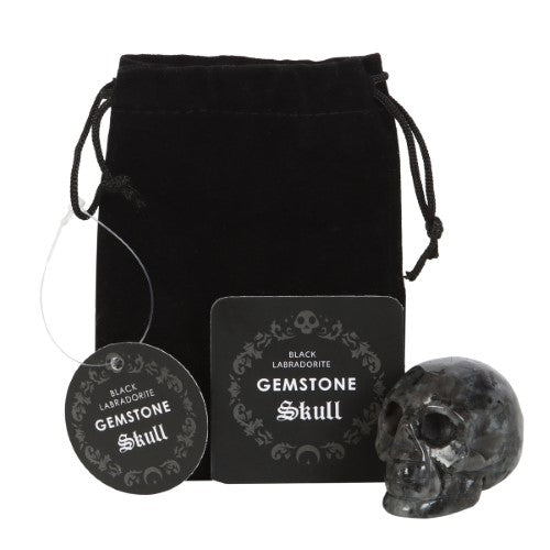 Black Labradorite Crystal Skull in sleek black, 4x5x2 cm, promotes grounding and abundance, ideal for desk decor and spiritual work.