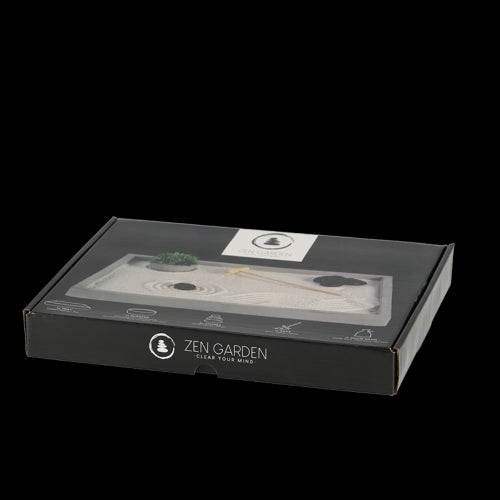 Elegant rectangular Zen garden with sand, stones, bamboo planter, and rake for mindfulness and relaxation.