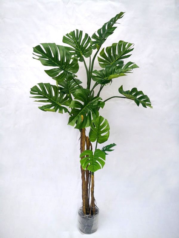 Lifelike 1.95m artificial monstera tree in a stylish pot, perfect for adding greenery to any indoor or outdoor space.