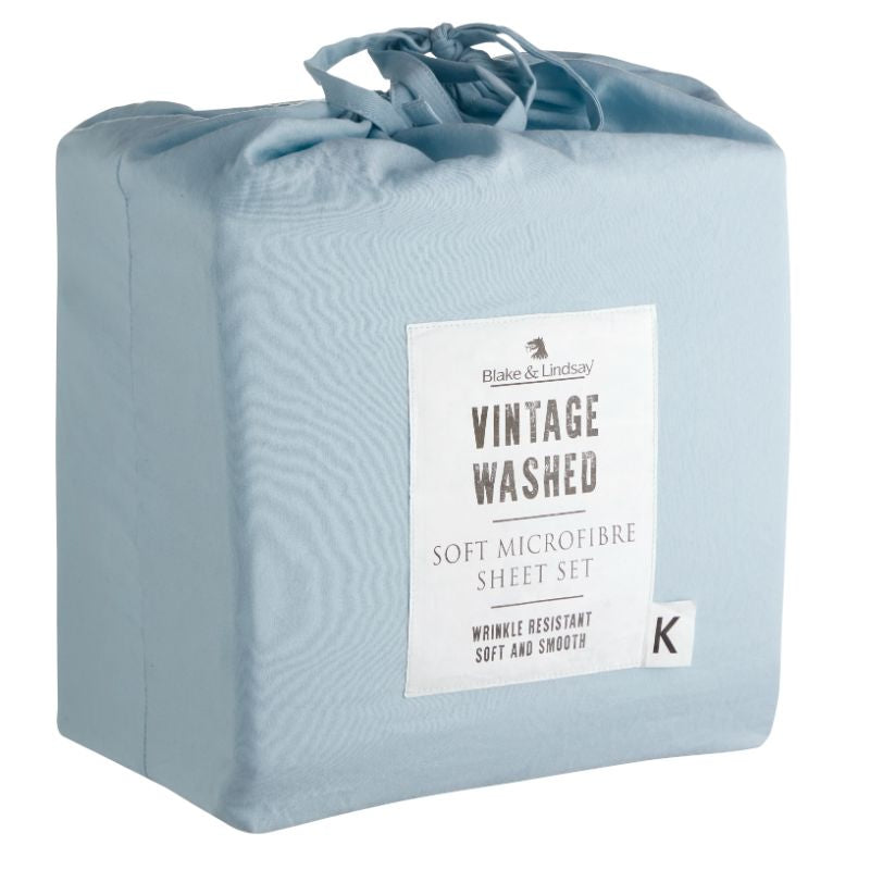 Queen sheet set in soft, vintage washed microfibre sky blue, featuring deep fitted sheet and matching pillowcases in a drawstring bag.