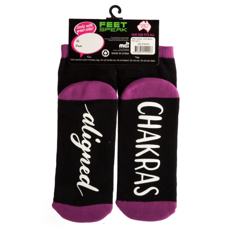 Vibrant chakra socks featuring anti-slip 'CHAKRAS ALIGNED' text, perfect for yoga or lounging in style.