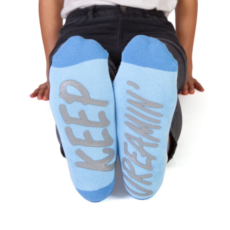 Cozy Speak Socks - Cloud Feet with cheerful cloud print, 'KEEP DREAMIN'' message, and snug one-size-fits-all fit.