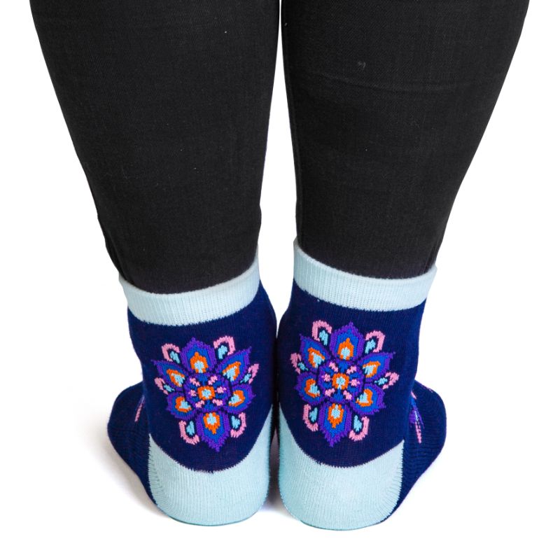 Indigo blue Mandala Feet Speak socks featuring petaled designs and anti-slip 'SPIRITUAL BALANCE' inscription.