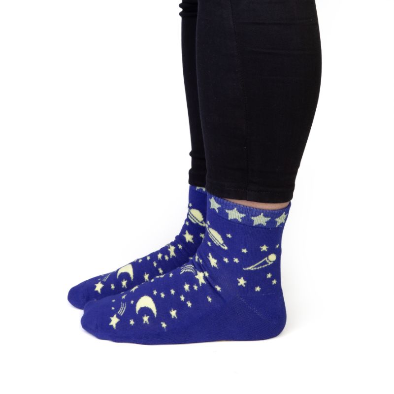 Vibrant socks with star and planet design, featuring "SPACED OUT" phrase, perfect for cosmic enthusiasts.