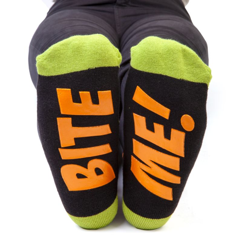 Cozy 20cm T-Rex socks with adorable designs, soft texture, and 'BITE ME' anti-slip feature for fun, stylish wear.