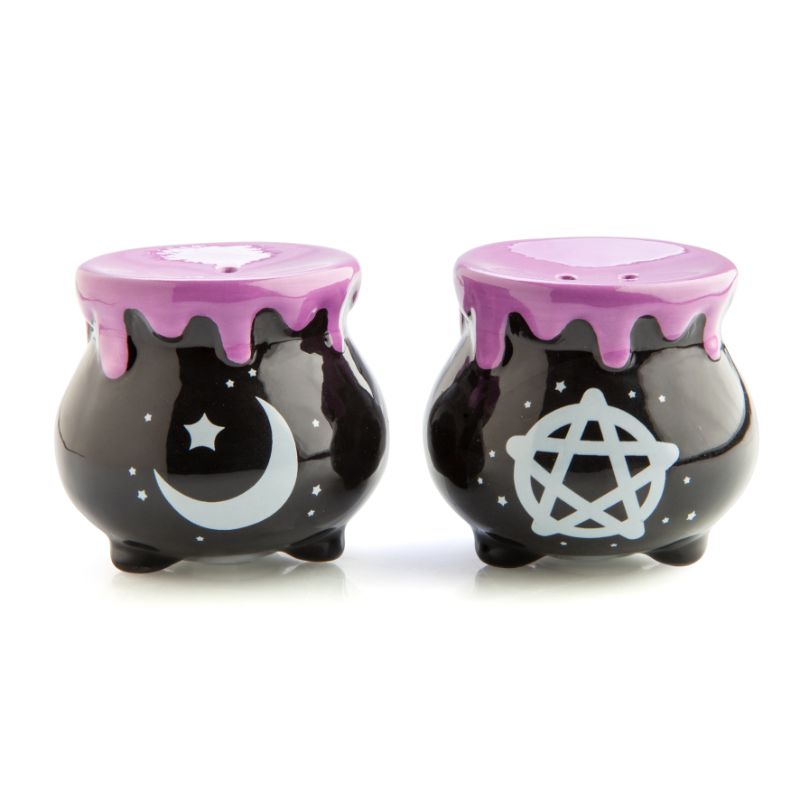 Whimsical cauldron-shaped salt and pepper shakers with pentacle and crescent moon designs, featuring purple drip accents.
