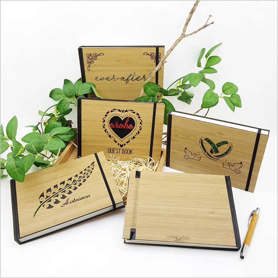 Elegant 'Eternity' guest book in FSC certified bamboo, featuring a laser-cut design and 128 acid-free pages for lasting memories.