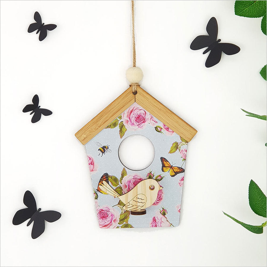 Whimsical birdhouse wall art with blue spots, crafted from laser-cut pine and 4mm MDF, ready to hang in any room.