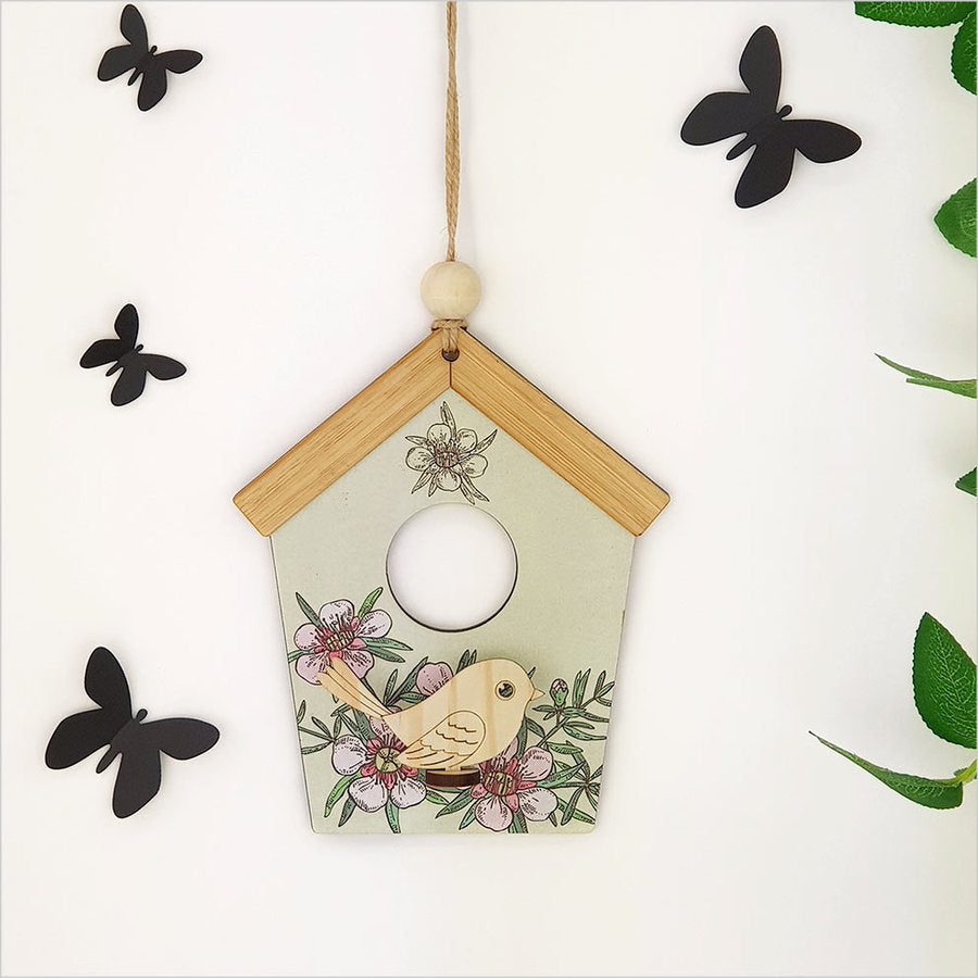 Birdhouse Wall Art: Green Manuka featuring vibrant green hues, laser-cut pine design, and ready-to-hang MDF construction.