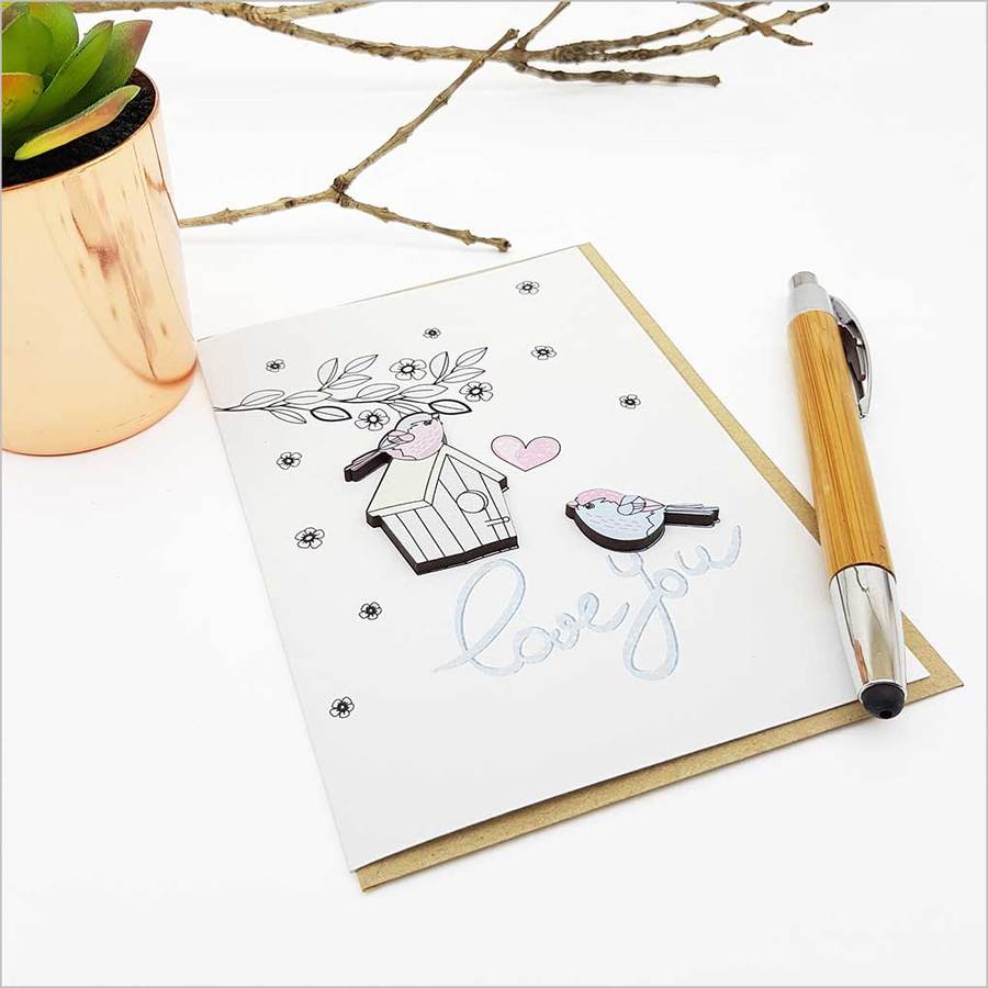 Greeting card featuring charming bird embellishments, perfect for expressing love on special occasions.