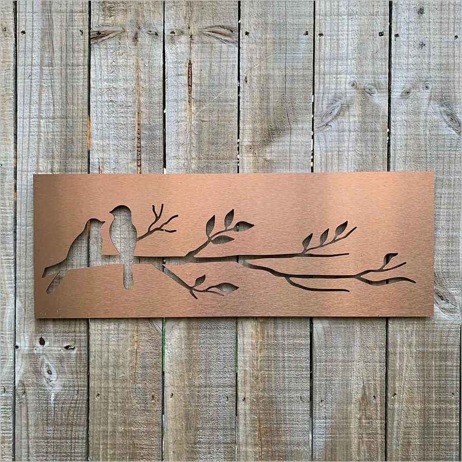 Brushed copper wall art featuring detailed birds on a branch, perfect for enhancing indoor or outdoor spaces.