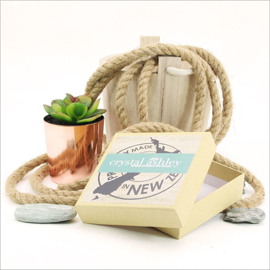 Vibrant NZ bird-themed coasters on durable MDF with cork base, elegantly packaged for home use or gifting.