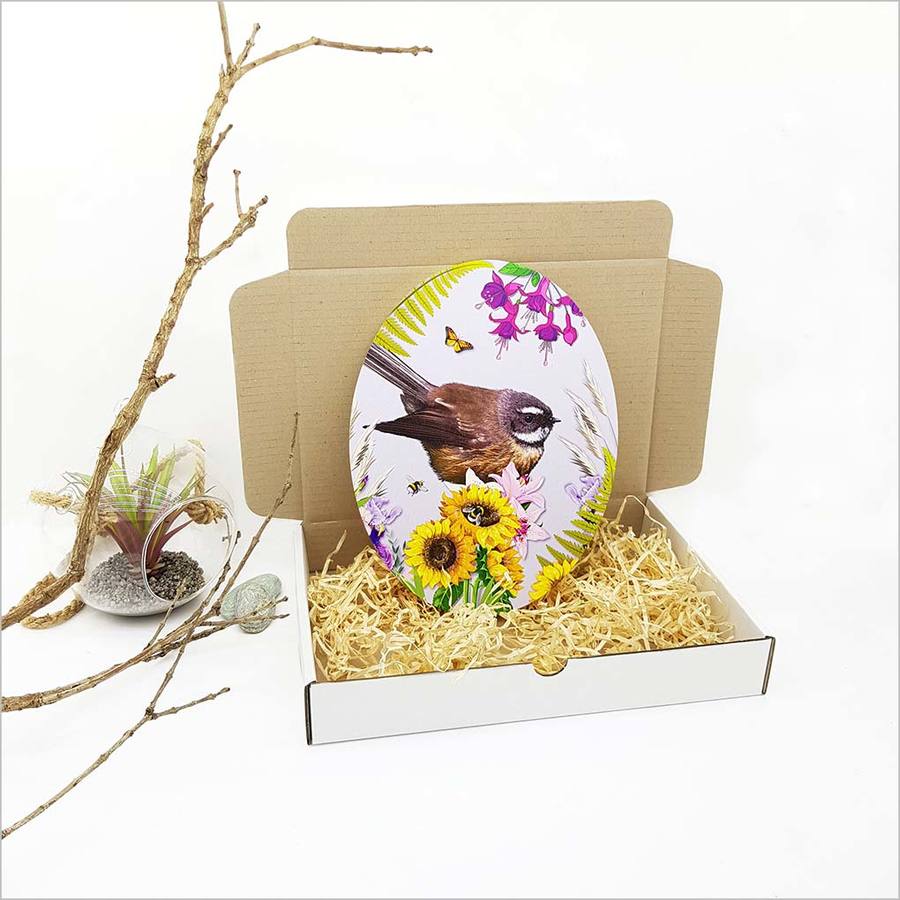 Kiwiana wall art featuring a vibrant Fantail bird against floral design, crafted from eco-friendly pine ply, ready to hang.