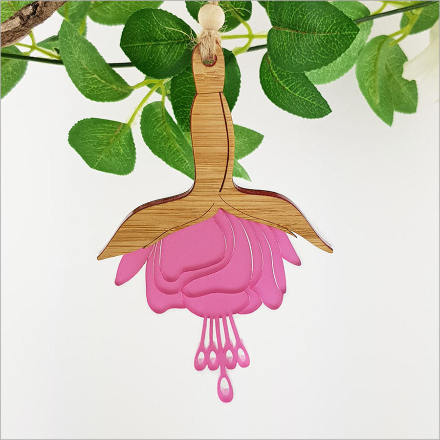 Elegant fuchsia flower hanging ornament made of laser-cut bamboo with satin acrylic finish, ideal for enhancing home décor.