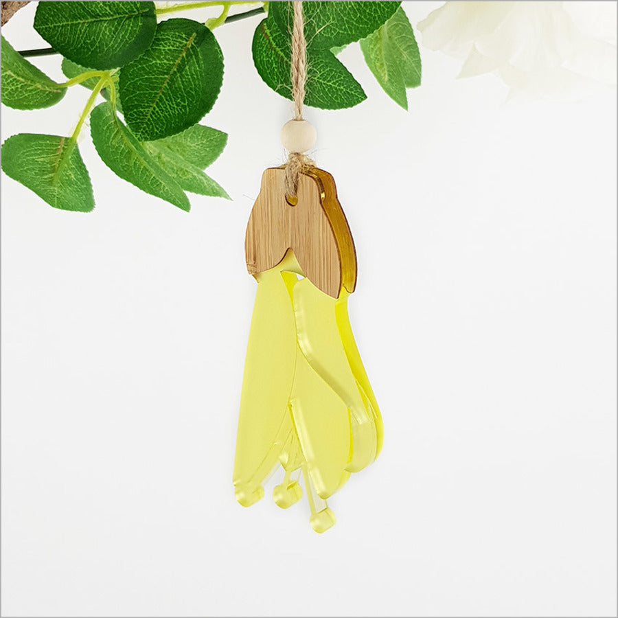 Kowhai flower hanging ornament made of bamboo and yellow satin acrylic, 57mm x 114mm, ready to display and gift.