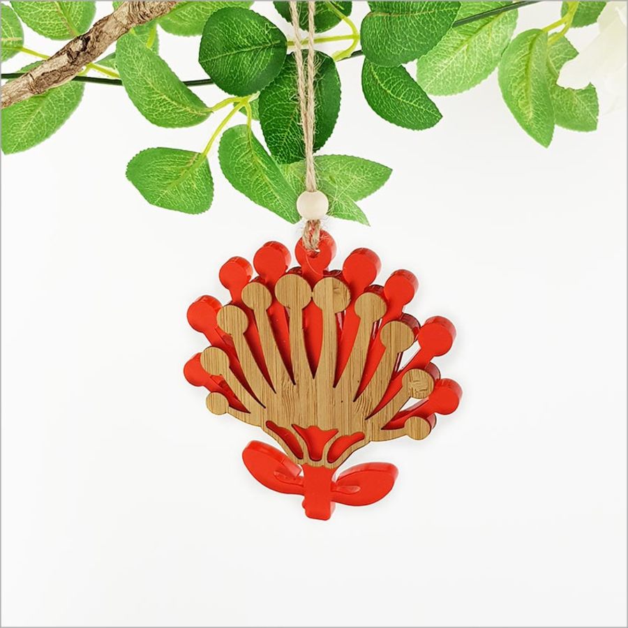 Vibrant red satin acrylic and bamboo Pohutukawa flower ornament, eco-friendly, ready to hang, perfect for festive decor.