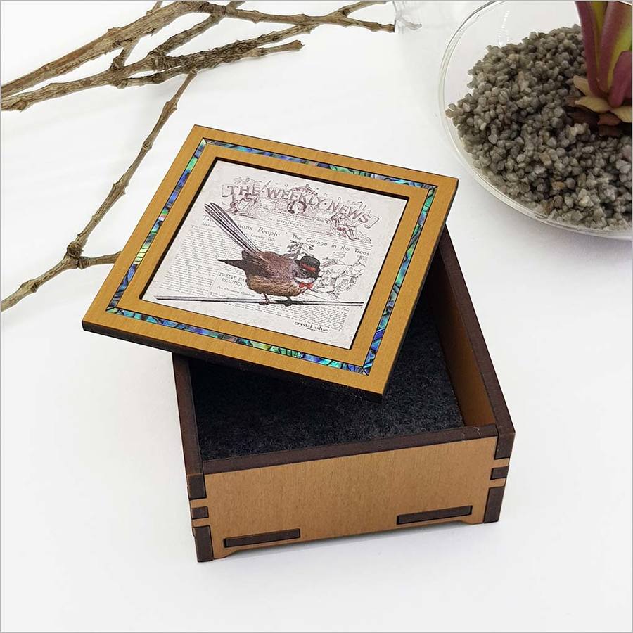 Vintage Fantail trinket box made of NZ veneer, featuring a nature-inspired design for storing small treasures.