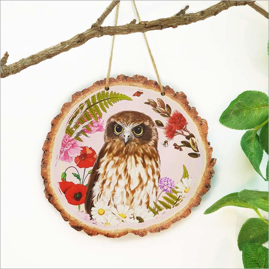 Wood slice art featuring the Ruru bird with floral details, handmade on 4mm veneer, perfect for nature-inspired decor.