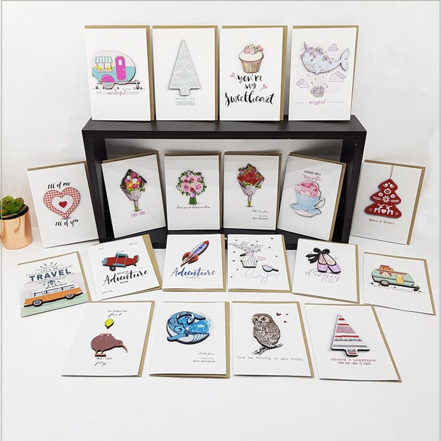 Greeting card featuring travel-themed embellishments, crafted from textured cardstock, ideal for inspiring wanderlust.